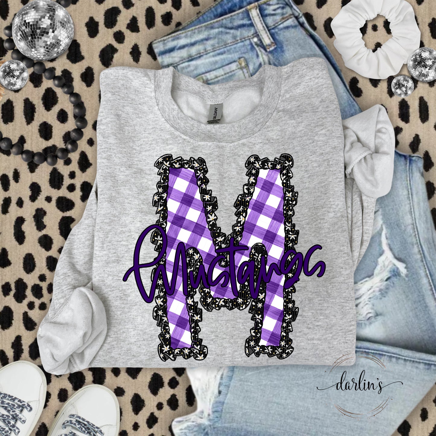 Daisy Ruffle M Mustangs Purple Shirt
