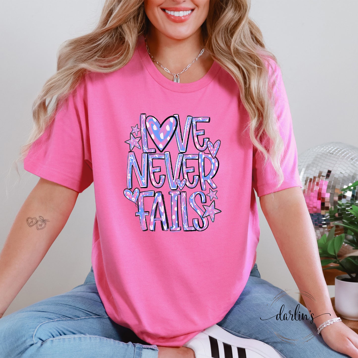 Love Never Fails Pink and Purple Shirt