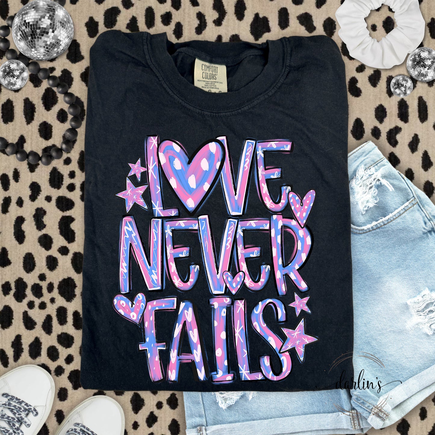 Love Never Fails Pink and Purple Shirt
