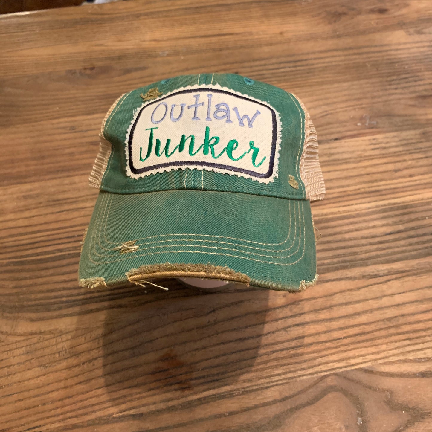 Outlaw Junker on Green Distressed Hat