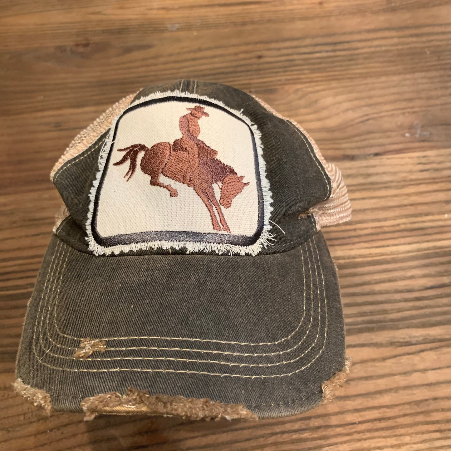 Brown Bucking Cowboy on Black Distressed Hat